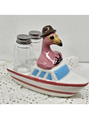 CRACKER BARREL FLAMINGO AND BOAT HOLDER WITH SALT AND PEPPER SHAKER SET